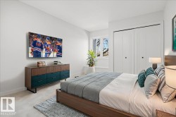 Bedroom featuring light colored carpet and a closet - 
