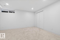 Unfurnished bedroom featuring carpet flooring, a closet, and recessed lighting - 