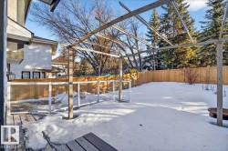 Yard layered in snow featuring a fenced backyard - 