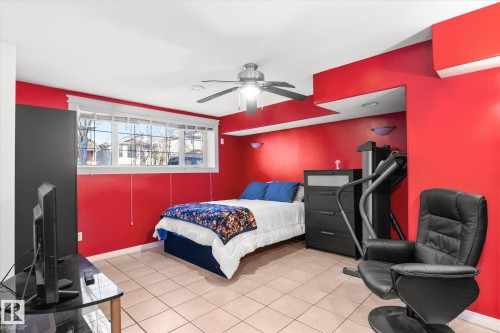 Bedroom featuring ceiling fan and light tile patterned floors - 3015 49, Beaumont, AB - Indoor