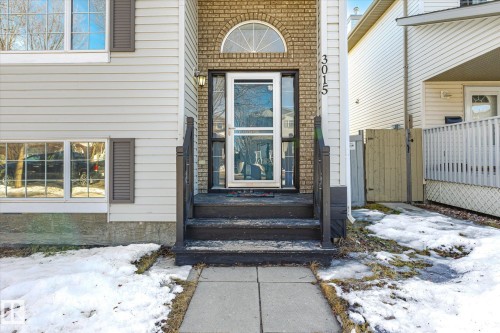 Snow covered property entrance featuring a gate - 3015 49, Beaumont, AB - Outdoor