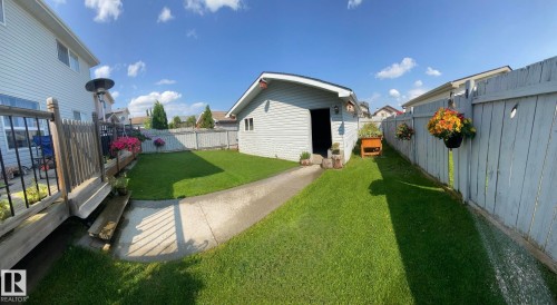 Fenced backyard with an outdoor structure - 3015 49, Beaumont, AB - Outdoor