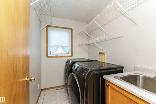5818 47 Avenue, Beaumont, AB - Indoor Photo Showing Laundry Room