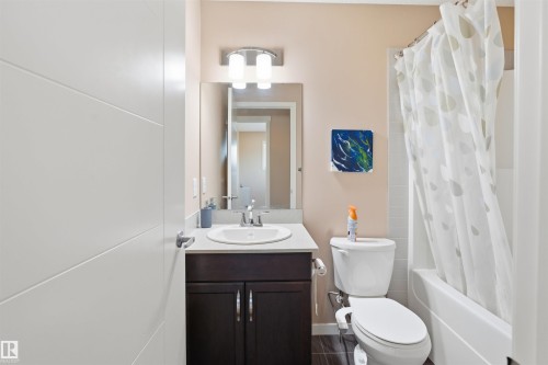 Bathroom featuring vanity and shower / bathtub combination with curtain - 5003 Andison Close, Edmonton, AB - Indoor Photo Showing Bathroom