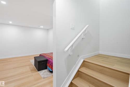 Stairs featuring wood finished floors and recessed lighting - 5003 Andison Close, Edmonton, AB - Indoor Photo Showing Other Room