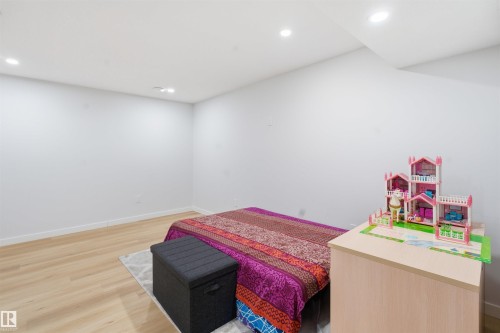 Bedroom featuring light wood-style flooring and recessed lighting - 5003 Andison Close, Edmonton, AB - Indoor Photo Showing Other Room