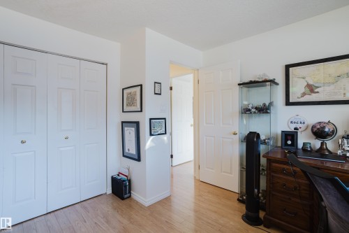 Office space with light wood-style flooring and baseboards - 115 10545 Saskatchewan Drive, Edmonton, AB - Indoor Photo Showing Other Room