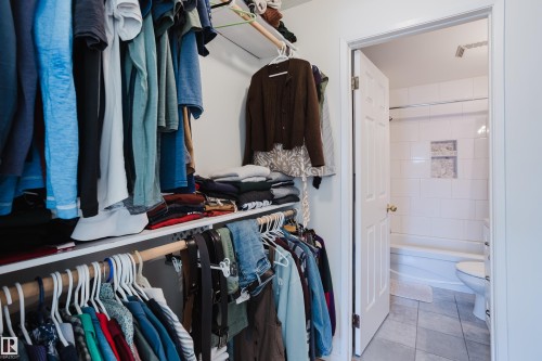 Walk in closet featuring light tile patterned flooring - 115 10545 Saskatchewan Drive, Edmonton, AB - Indoor With Storage