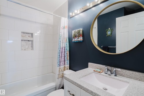 Full bathroom featuring vanity and shower / bath combo - 115 10545 Saskatchewan Drive, Edmonton, AB - Indoor Photo Showing Bathroom
