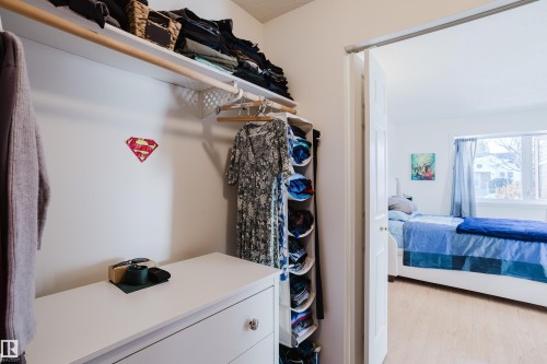 Walk in closet featuring light wood-type flooring - 115 10545 Saskatchewan Drive, Edmonton, AB - Indoor