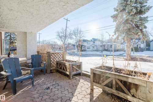 It's basically your own lawn. You can dress up like the characters in Alice in Wonderland and set up a game of croquet. - 115 10545 Saskatchewan Drive, Edmonton, AB - Outdoor With Deck Patio Veranda
