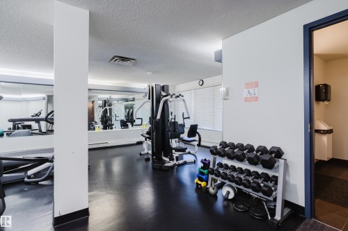 Gym with a textured ceiling - 115 10545 Saskatchewan Drive, Edmonton, AB - Indoor Photo Showing Gym Room