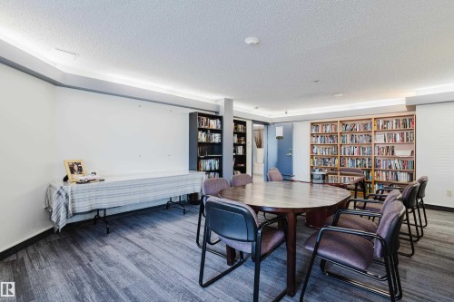 Grab a book and relax, just please put it back in alphabetical order, by authour. - 115 10545 Saskatchewan Drive, Edmonton, AB - Indoor Photo Showing Dining Room