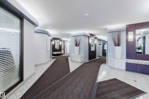 Community lobby featuring a textured ceiling - 115 10545 Saskatchewan Drive, Edmonton, AB - Indoor