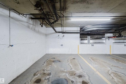 The stall even has a rack to hang and lock your bikes. - 115 10545 Saskatchewan Drive, Edmonton, AB - Indoor Photo Showing Garage