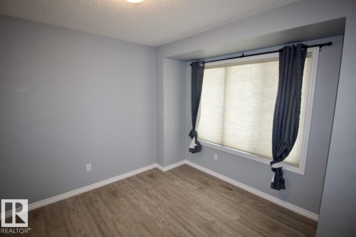 Unfurnished room with a textured ceiling and wood finished floors - Upper 516 Ebbers Way, Edmonton, AB - Indoor Photo Showing Other Room