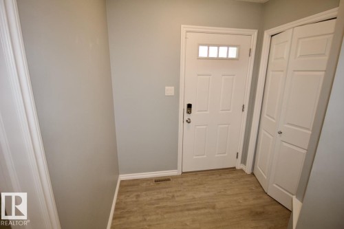 Doorway featuring baseboards and wood finished floors - Upper 516 Ebbers Way, Edmonton, AB - Indoor Photo Showing Other Room