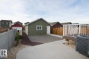 View of side of property featuring an outdoor structure, a fenced backyard, and a patio area - Upper 516 Ebbers Way, Edmonton, AB  - Outdoor 