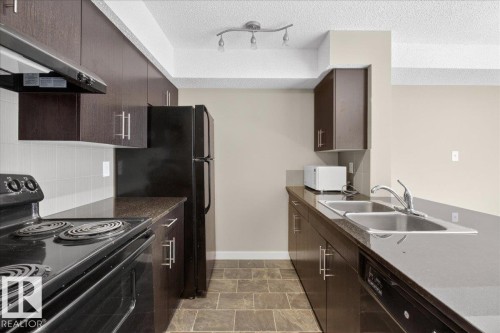 213 1070 Mcconachie Boulevard, Edmonton, AB - Indoor Photo Showing Kitchen With Double Sink