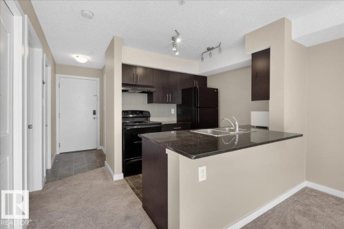 213 1070 Mcconachie Boulevard, Edmonton, AB - Indoor Photo Showing Kitchen With Double Sink