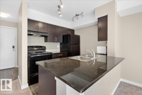 213 1070 Mcconachie Boulevard, Edmonton, AB - Indoor Photo Showing Kitchen With Double Sink