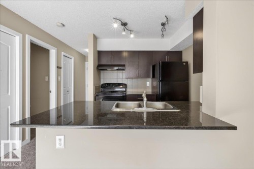 213 1070 Mcconachie Boulevard, Edmonton, AB - Indoor Photo Showing Kitchen With Double Sink