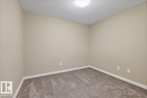 213 1070 Mcconachie Boulevard, Edmonton, AB - Indoor Photo Showing Other Room