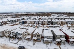 Snowy aerial view featuring a residential view - 