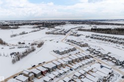 Snowy aerial view featuring a residential view - 