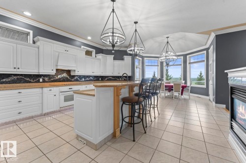 3006 Wayne Way, Cold Lake, AB - Indoor Photo Showing Kitchen With Fireplace