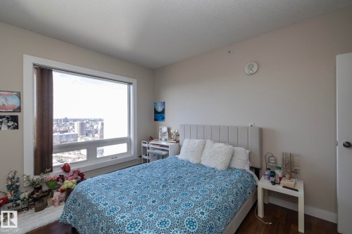 Bedroom featuring dark wood-type flooring and baseboards - 2005 10136 104 Street, Edmonton, AB - Indoor Photo Showing Bedroom