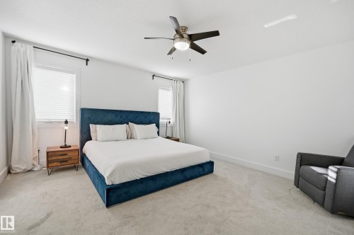 Carpeted bedroom with ceiling fan and baseboards - 30 Willow Link, Fort Saskatchewan, AB - Indoor Photo Showing Bedroom