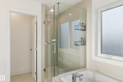 Bathroom featuring a shower stall, a bath, and tile patterned floors - 30 Willow Link, Fort Saskatchewan, AB - Indoor Photo Showing Bathroom