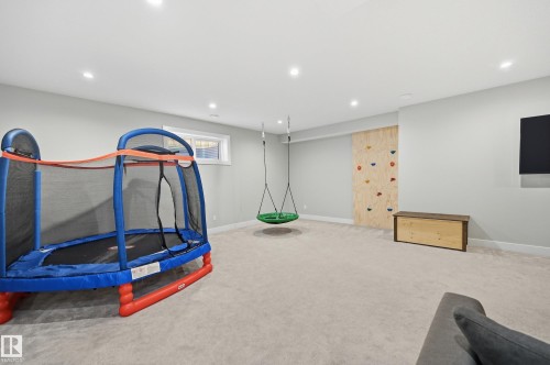 Recreation room with carpet floors and recessed lighting - 30 Willow Link, Fort Saskatchewan, AB - Indoor Photo Showing Other Room
