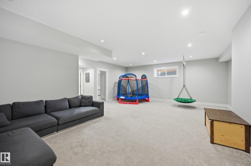 Living room featuring carpet flooring and recessed lighting - 30 Willow Link, Fort Saskatchewan, AB - Indoor