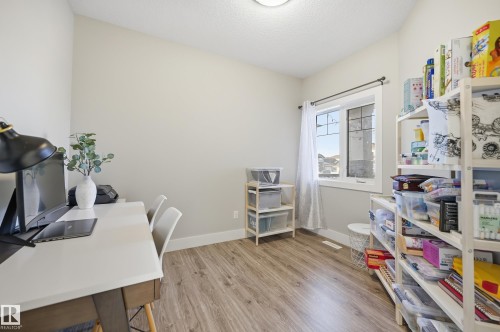 Office area with light wood finished floors and a textured ceiling - 30 Willow Link, Fort Saskatchewan, AB - Indoor Photo Showing Office
