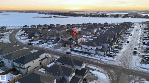 Snowy aerial view featuring a residential view - 30 Willow Link, Fort Saskatchewan, AB - Outdoor With Body Of Water With View
