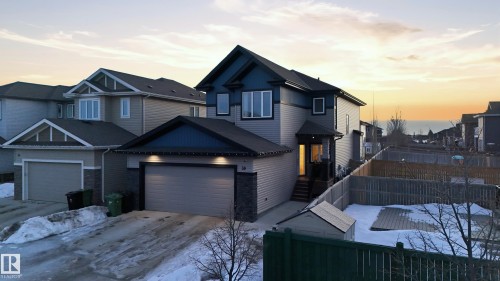 View of front of property with concrete driveway and an attached garage - 30 Willow Link, Fort Saskatchewan, AB - Outdoor