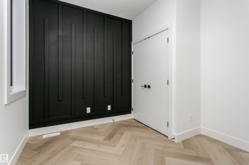 Unfurnished bedroom with parquet floors and a closet - 3248 Pelerin Crescent, Beaumont, AB - Indoor Photo Showing Other Room