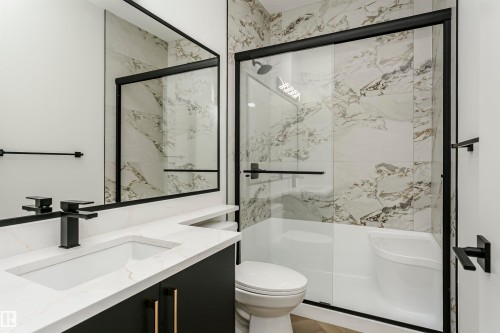 Full bath with vanity and a marble finish shower - 3248 Pelerin Crescent, Beaumont, AB - Indoor Photo Showing Bathroom