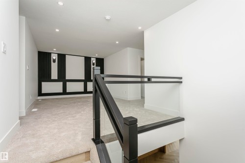 Hallway featuring recessed lighting, an upstairs landing, and light colored carpet - 3248 Pelerin Crescent, Beaumont, AB - Indoor Photo Showing Other Room
