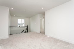 Spare room featuring light colored carpet and recessed lighting - 