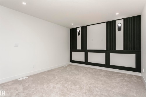 Spare room featuring light colored carpet and recessed lighting - 3248 Pelerin Crescent, Beaumont, AB - Indoor Photo Showing Other Room