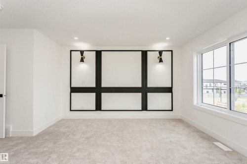 Unfurnished room featuring light carpet and recessed lighting - 3248 Pelerin Crescent, Beaumont, AB - Indoor Photo Showing Other Room