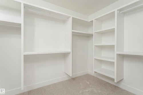 Walk in closet featuring light colored carpet - 3248 Pelerin Crescent, Beaumont, AB - Indoor With Storage