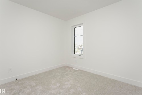 Empty room with baseboards and carpet - 3248 Pelerin Crescent, Beaumont, AB - Indoor Photo Showing Other Room