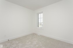 Empty room with baseboards and carpet - 