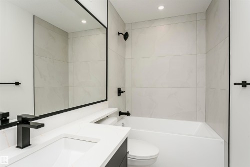 Bathroom with vanity, bathtub / shower combination, and recessed lighting - 3248 Pelerin Crescent, Beaumont, AB - Indoor Photo Showing Bathroom
