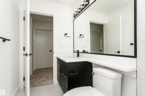 Half bath with vanity and toilet - 3248 Pelerin Crescent, Beaumont, AB - Indoor Photo Showing Bathroom