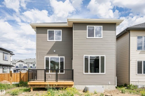 Back of house featuring a wooden deck - 3248 Pelerin Crescent, Beaumont, AB - Outdoor With Deck Patio Veranda With Exterior